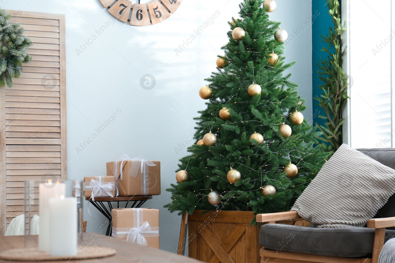 Photo of Beautiful decorated Christmas tree in living room