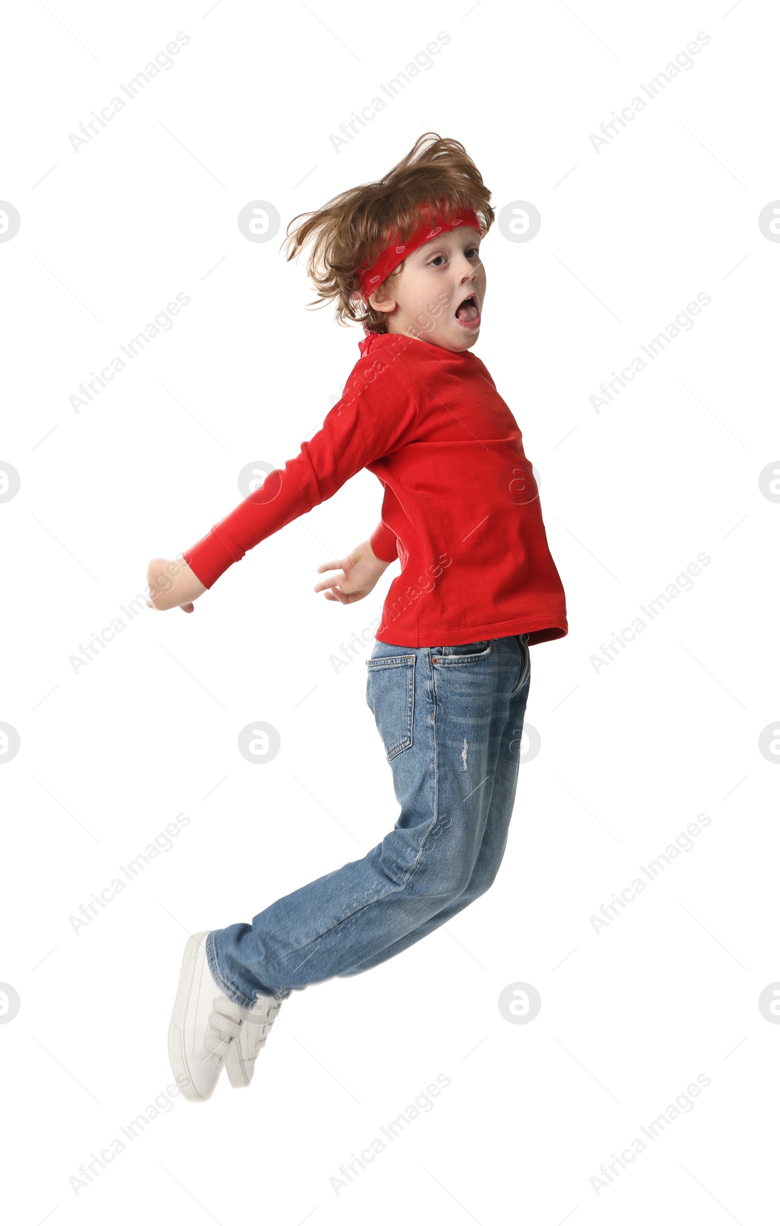 Photo of Happy little boy dancing on white background