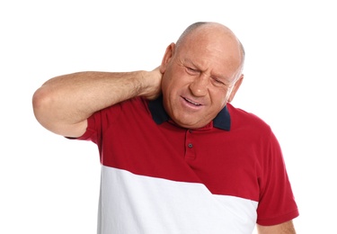 Mature man suffering from neck pain on white background