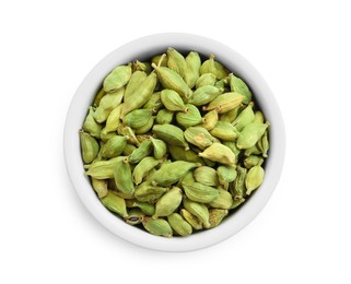 Photo of Dry cardamom pods in bowl isolated on white, top view