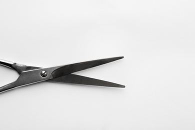 Pair of sharp scissors on white background