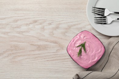 Photo of Herring under fur coat salad served on white wooden table, flat lay with space for text. Traditional Russian dish