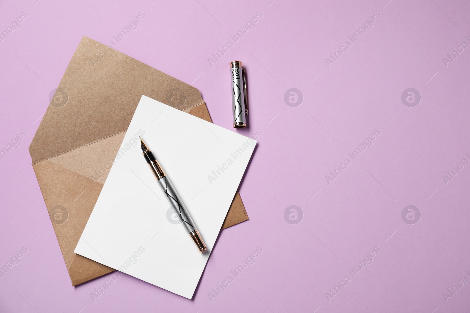 Photo of Blank sheet of paper, letter envelope and pen on violet background, top view. Space for text