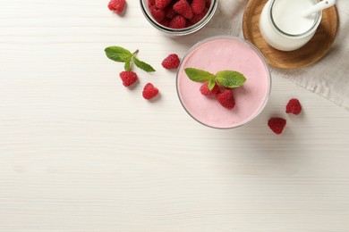 Photo of Delicious raspberry mousse with mint on white wooden table, flat lay. Space for text