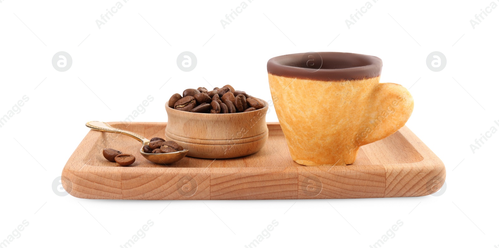 Photo of Wooden tray with edible espresso cookie cup and roasted beans isolated on white