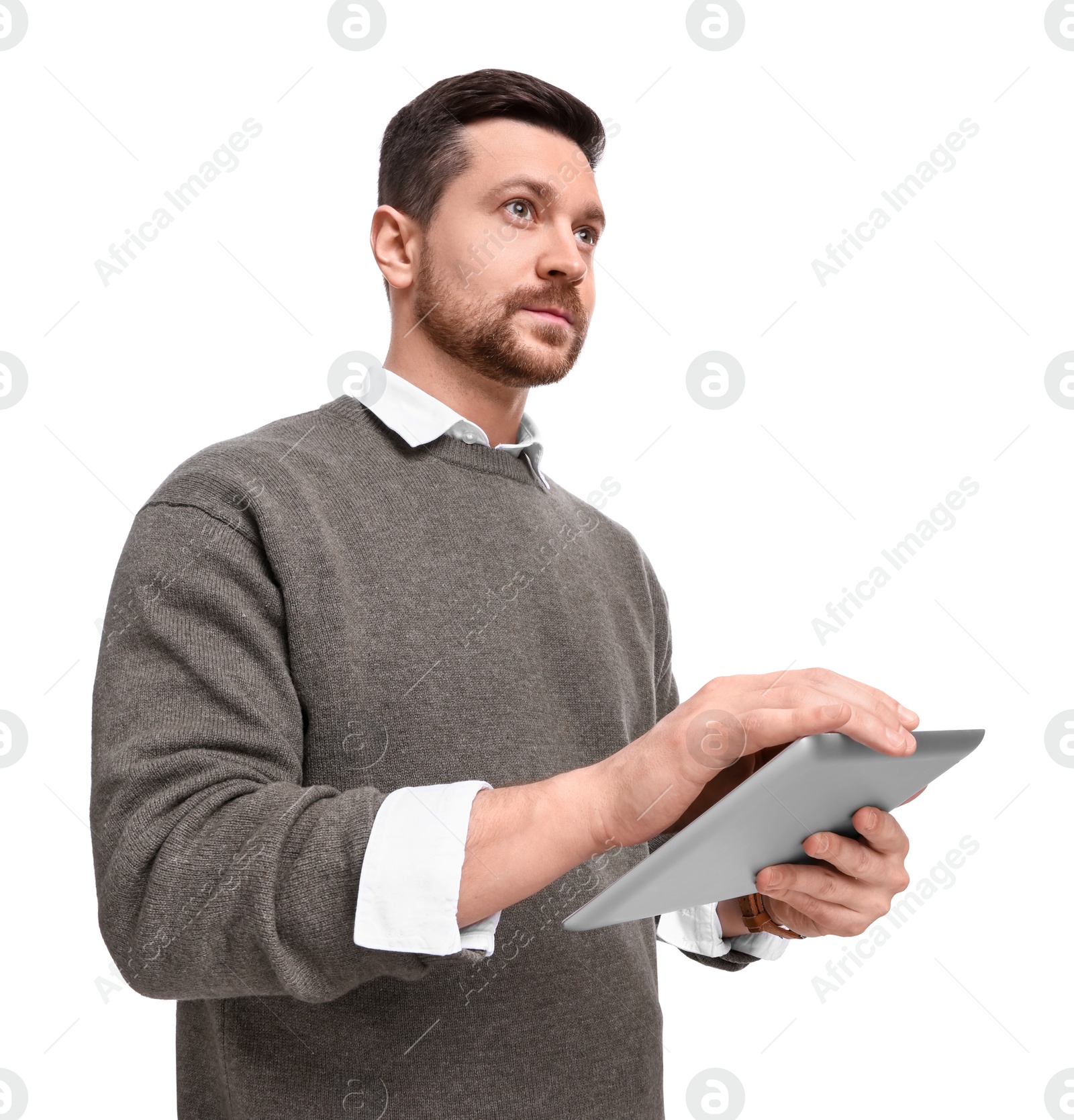 Photo of Handsome bearded businessman using tablet on white background, low angle view