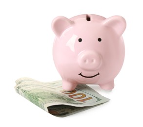 Piggy bank and money on white background