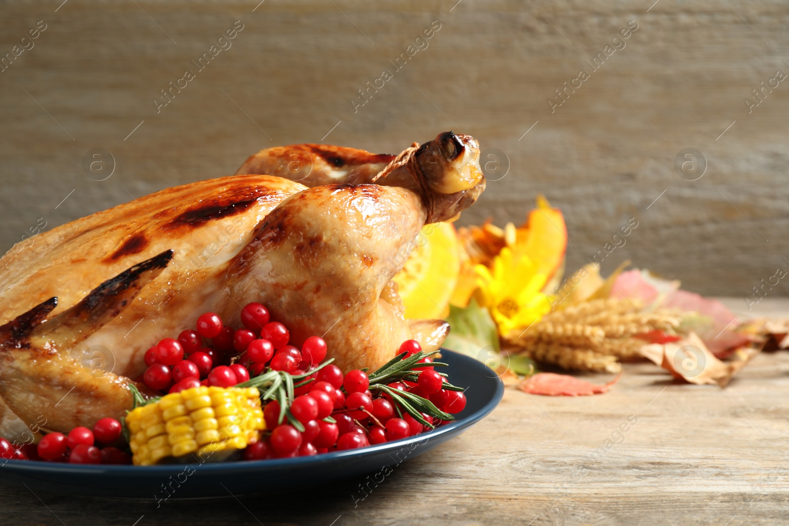 Photo of Plate with delicious turkey on wooden background. Happy Thanksgiving day
