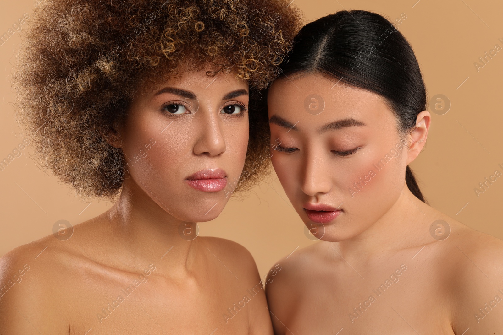 Photo of Beautiful young women with healthy skin on beige background