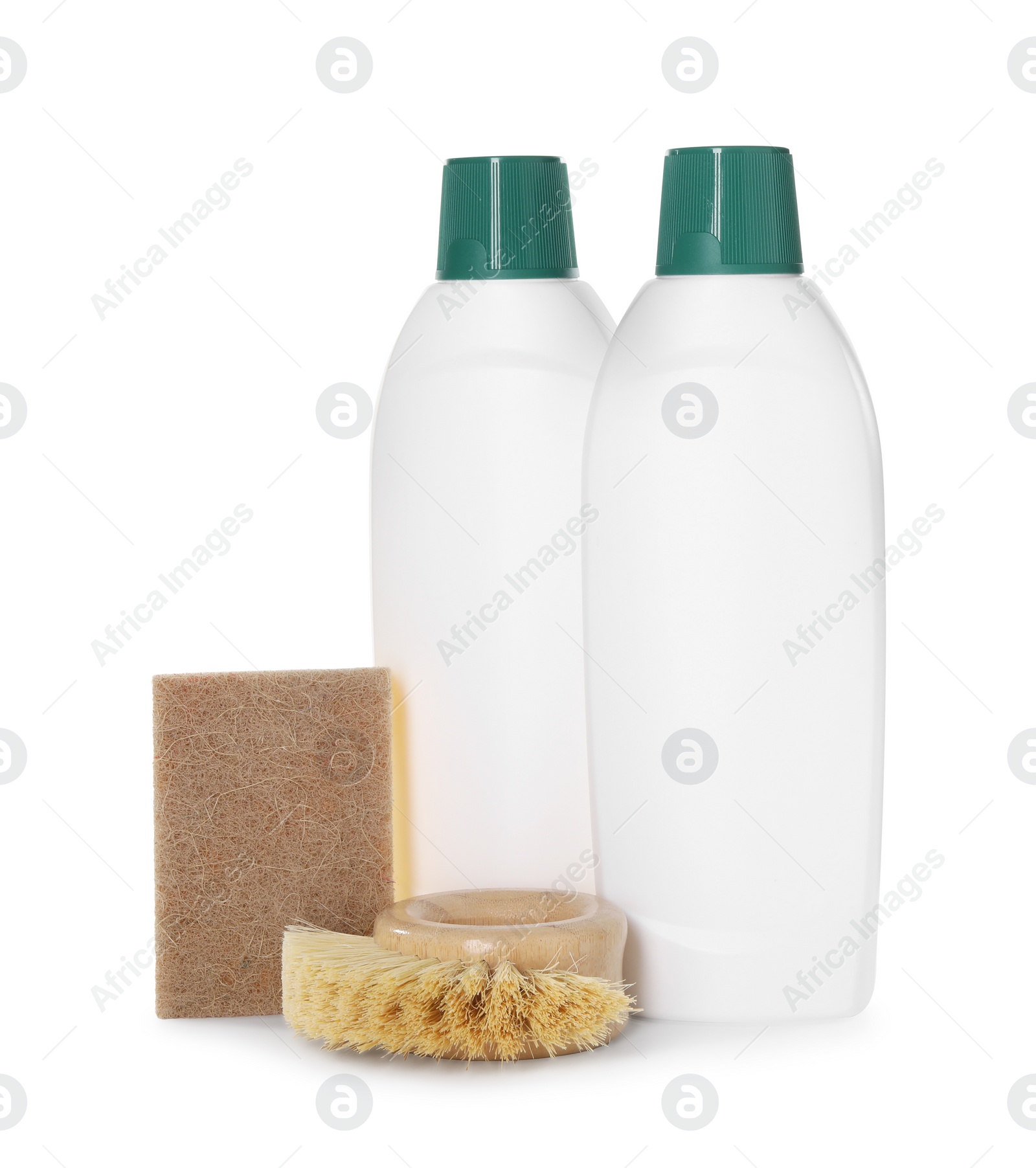 Photo of Bottles of cleaning product, sponge and brush isolated on white