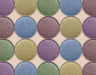 Image of Collage of beautiful different eye shadow refill pans on beige background