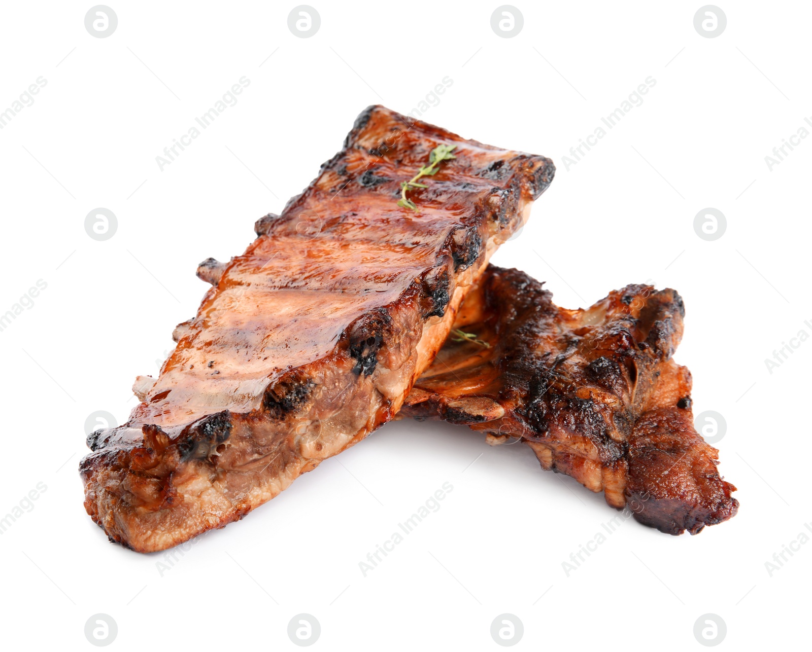 Photo of Tasty grilled ribs with thyme isolated on white