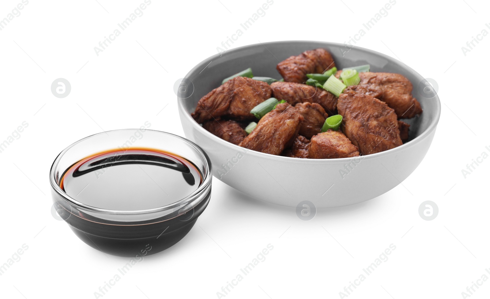 Photo of Tasty soy sauce and roasted meat isolated on white