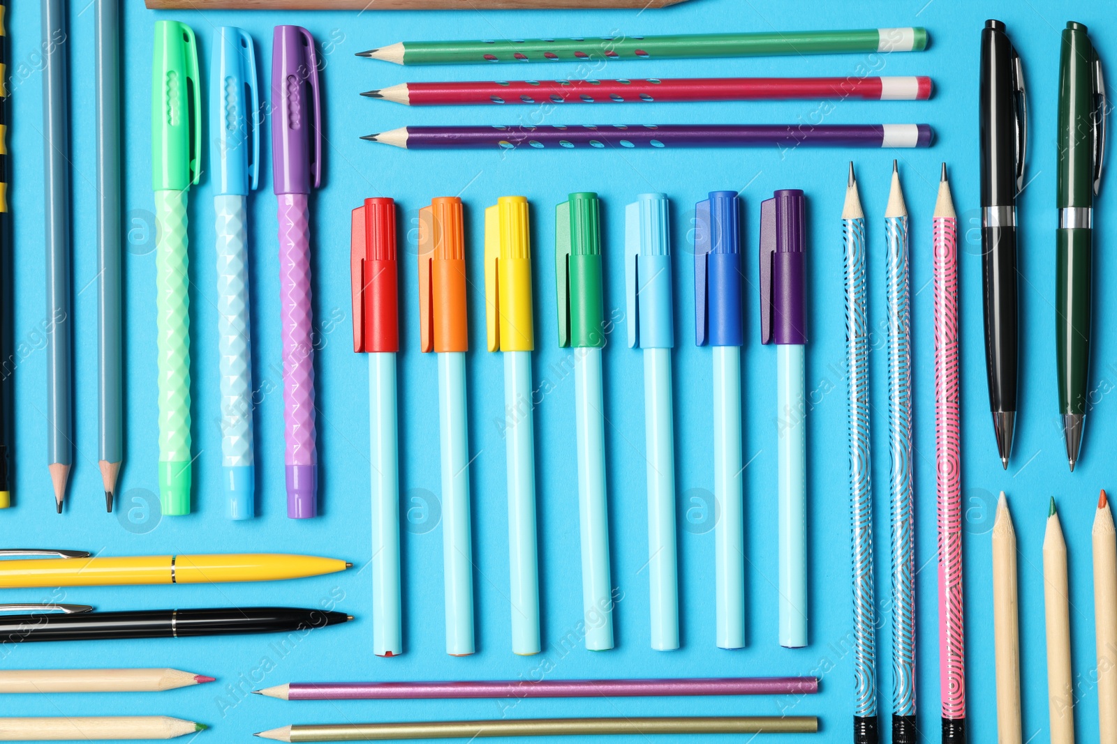 Photo of Different stationery on light blue background, flat lay. Back to school