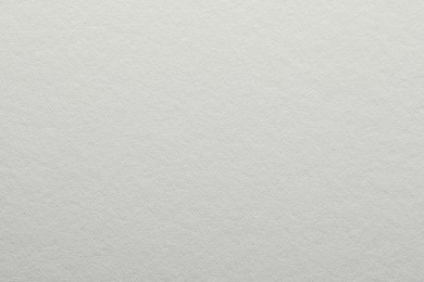 Photo of Texture of white paper sheet as background, closeup