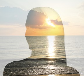Image of Silhouette of woman and beautiful seascape at sunset, double exposure