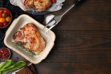 Photo of Tasty marinated meat, rosemary and spices on wooden table, flat lay. Space for text