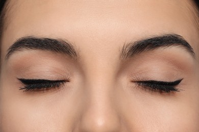 Young woman with permanent eyeliner makeup, closeup