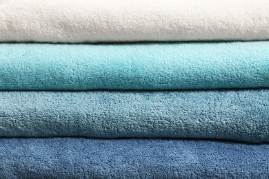 Photo of Stack of clean towels as background, closeup