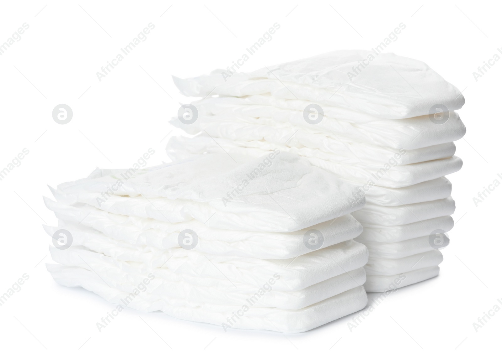 Photo of Stacks of baby diapers isolated on white