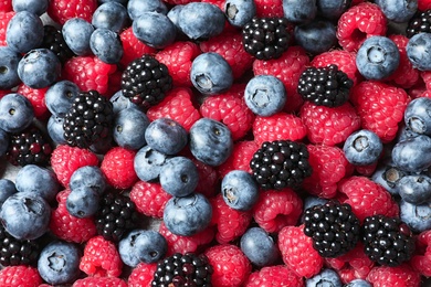 Photo of Raspberries, blackberries and blueberries as background