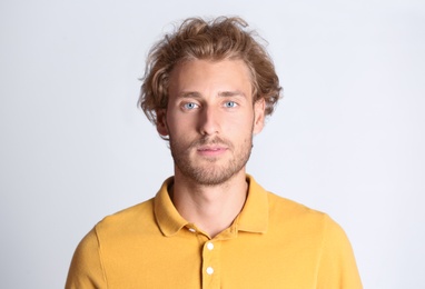 Portrait of handsome young man on white background