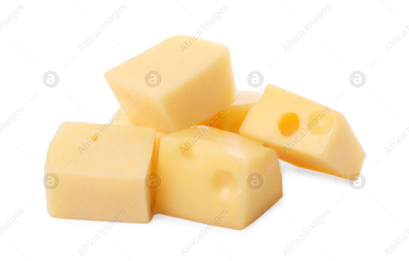 Photo of Cubes of delicious cheese isolated on white