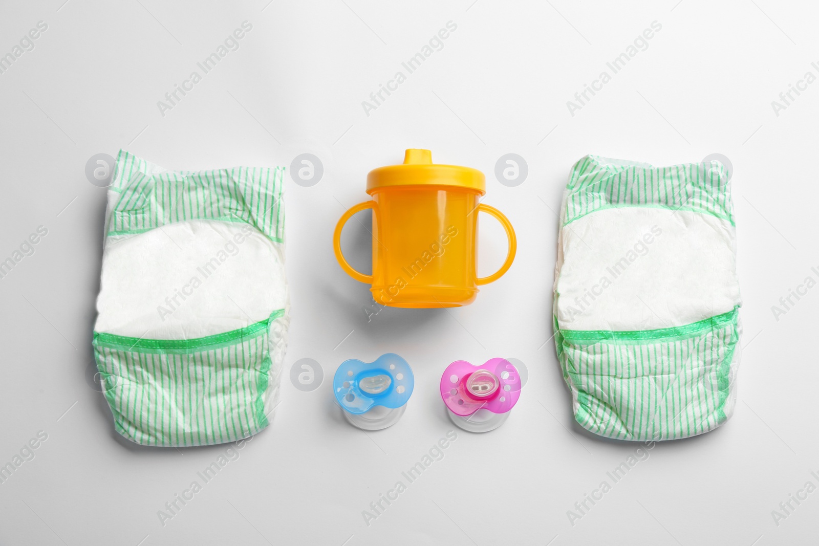 Photo of Flat lay composition with baby accessories on white background