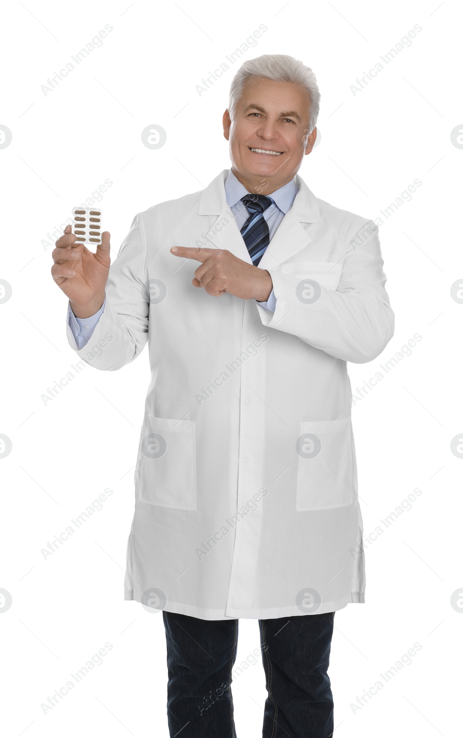 Photo of Senior pharmacist with pills on white background