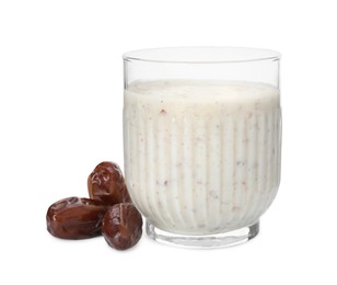 Photo of Glass of delicious smoothie and dried dates on white background