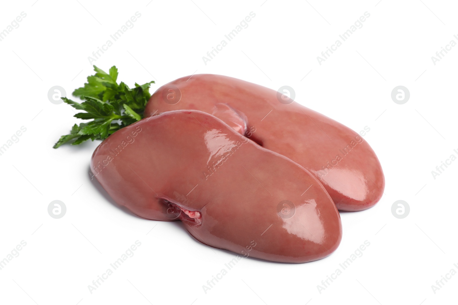 Photo of Fresh raw pork kidneys with parsley on white background