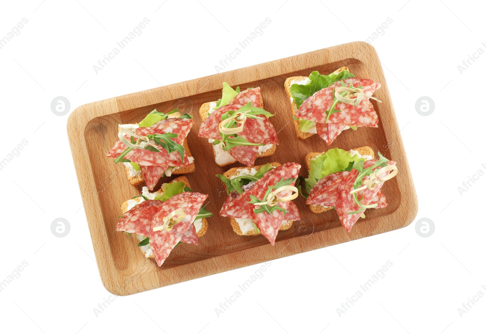 Photo of Tasty canapes with salami, greens and cream cheese isolated on white, top view