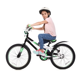 Portrait of cute little girl with bicycle on white background