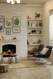 Stylish living room interior with comfortable chairs and decorative fireplace