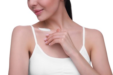 Woman with smear of body cream on her collarbone against white background, closeup