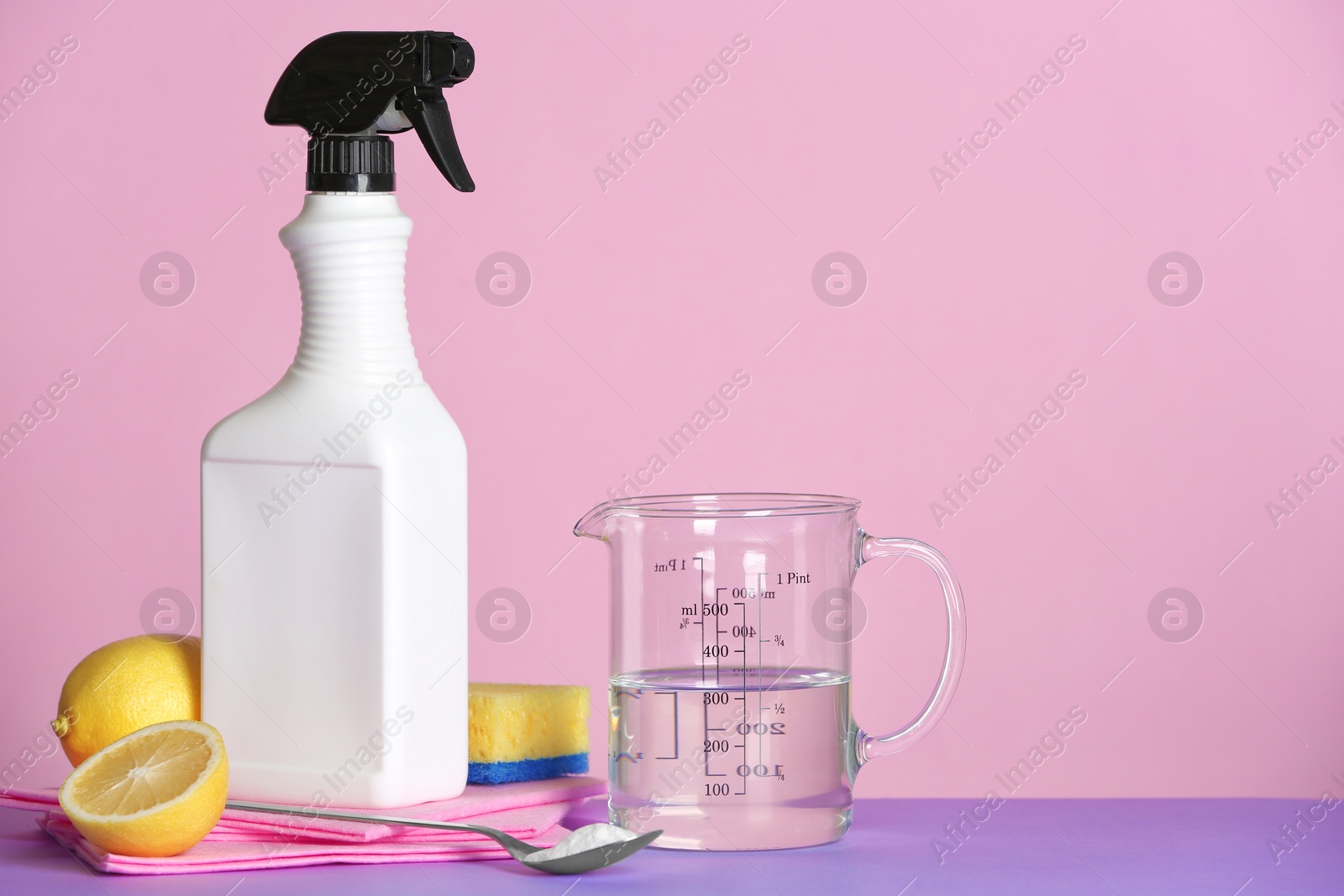 Photo of Composition with vinegar and cleaning supplies on table. Space for text