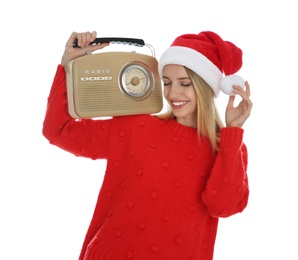 Photo of Happy woman with vintage radio on white background. Christmas music