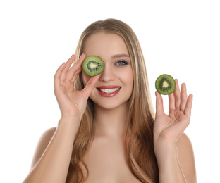 Young woman with cut kiwi on white background. Vitamin rich food