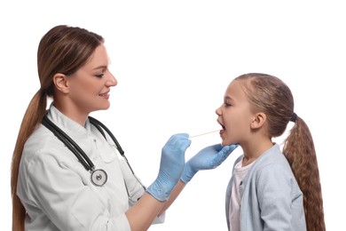 Photo of Smiling doctor examining girl`s oral cavity with tongue depressor on white background