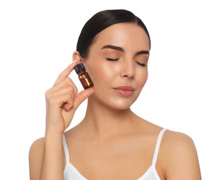 Photo of Young woman with bottle of essential oil on white background