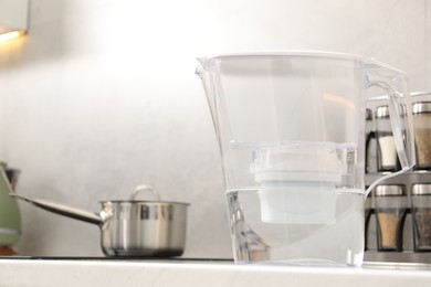 Photo of Water filter jug on countertop in kitchen