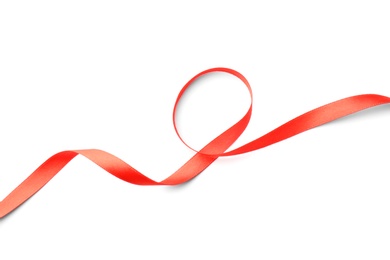 Photo of Simple red ribbon on white background, top view. Festive decoration