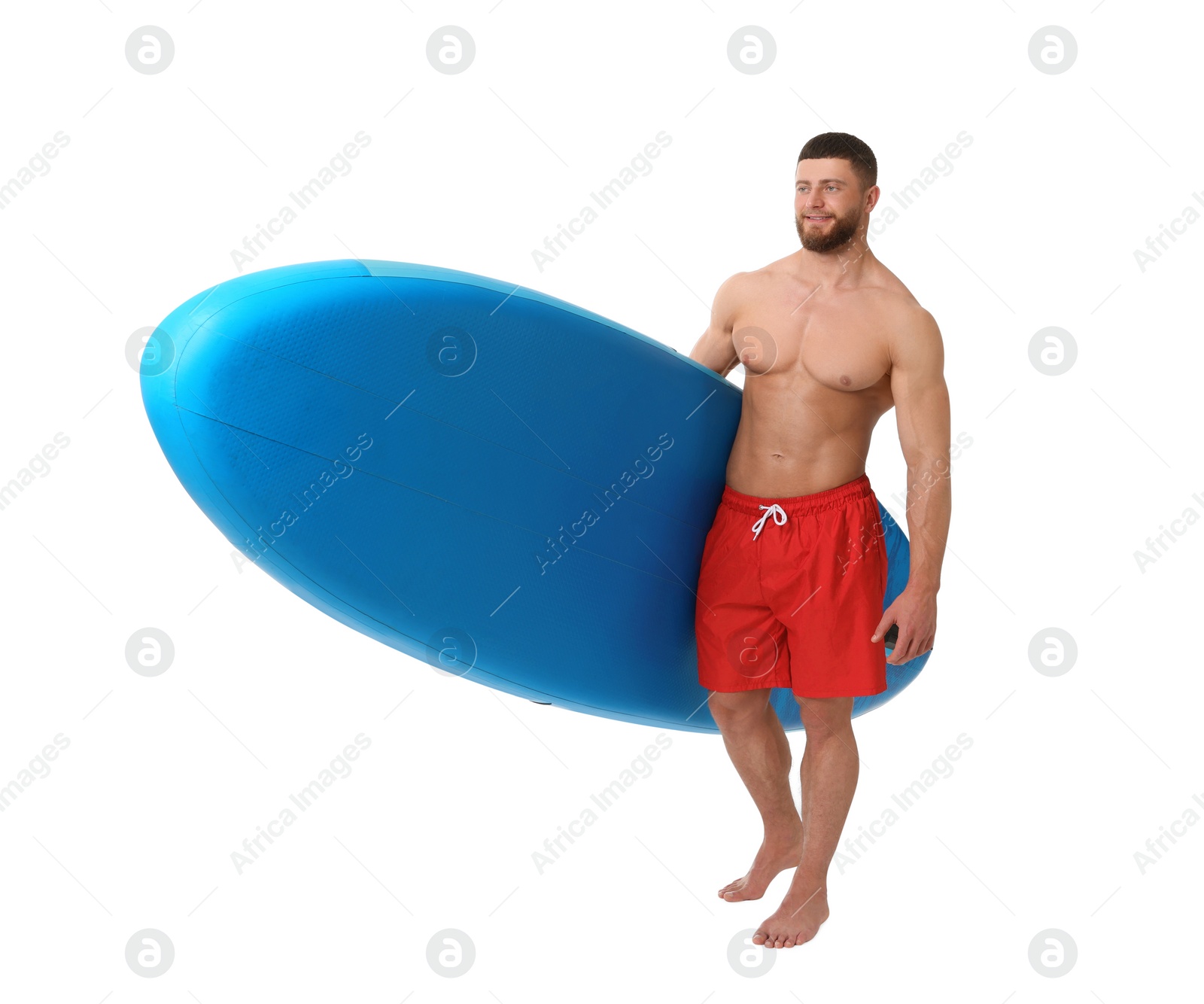 Photo of Handsome man with blue SUP board on white background