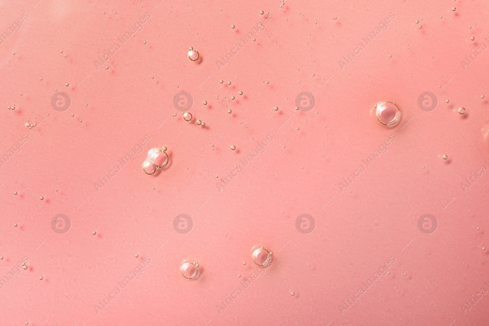Photo of Sample of hydrophilic oil on pink background, top view