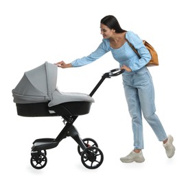 Happy young woman with baby stroller on white background
