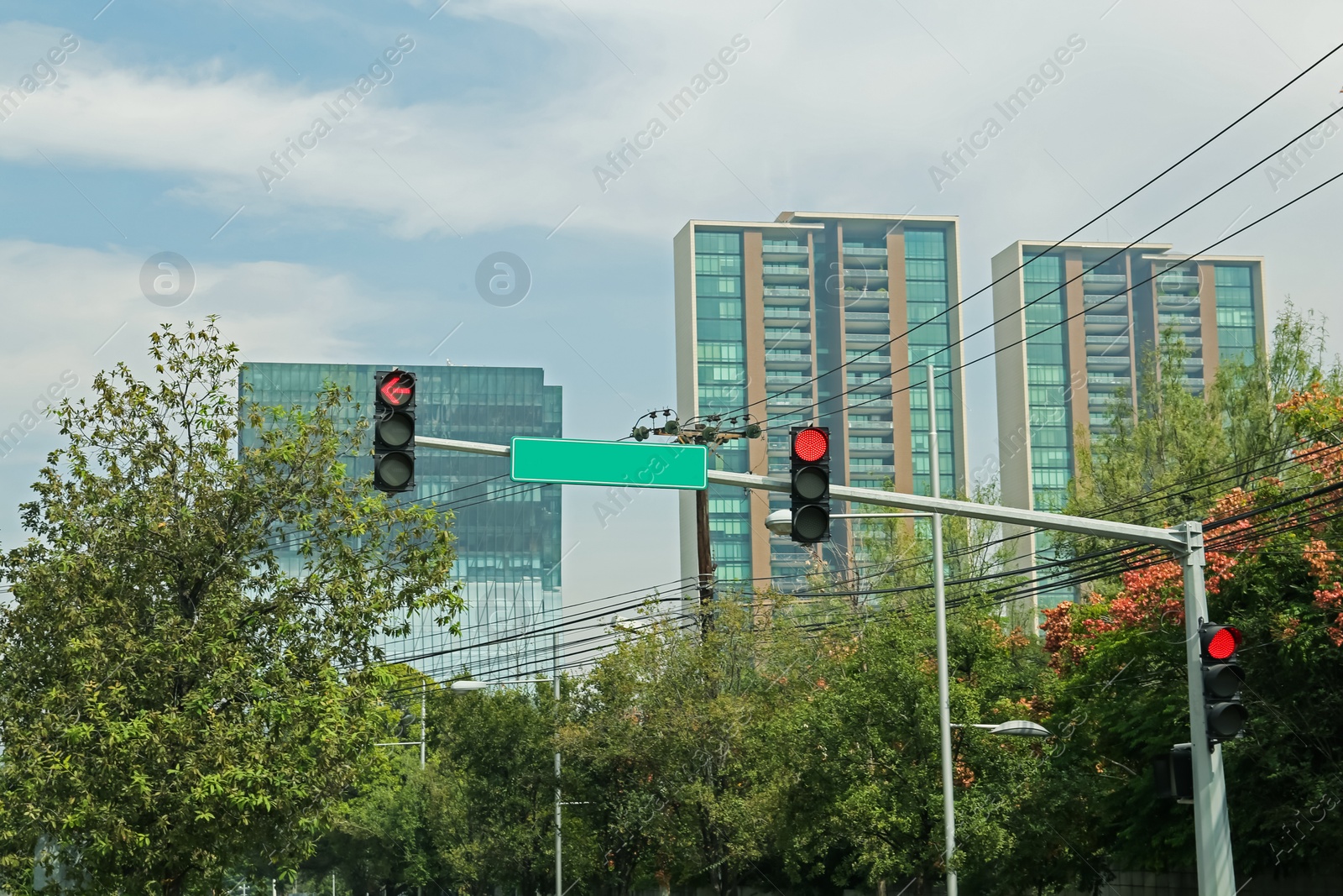 Photo of Overhead traffic lights in city. Road rules