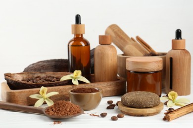 Photo of Homemade cosmetic products and fresh ingredients on white wooden table