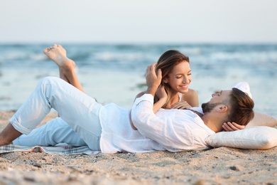 Young couple spending time together on beach