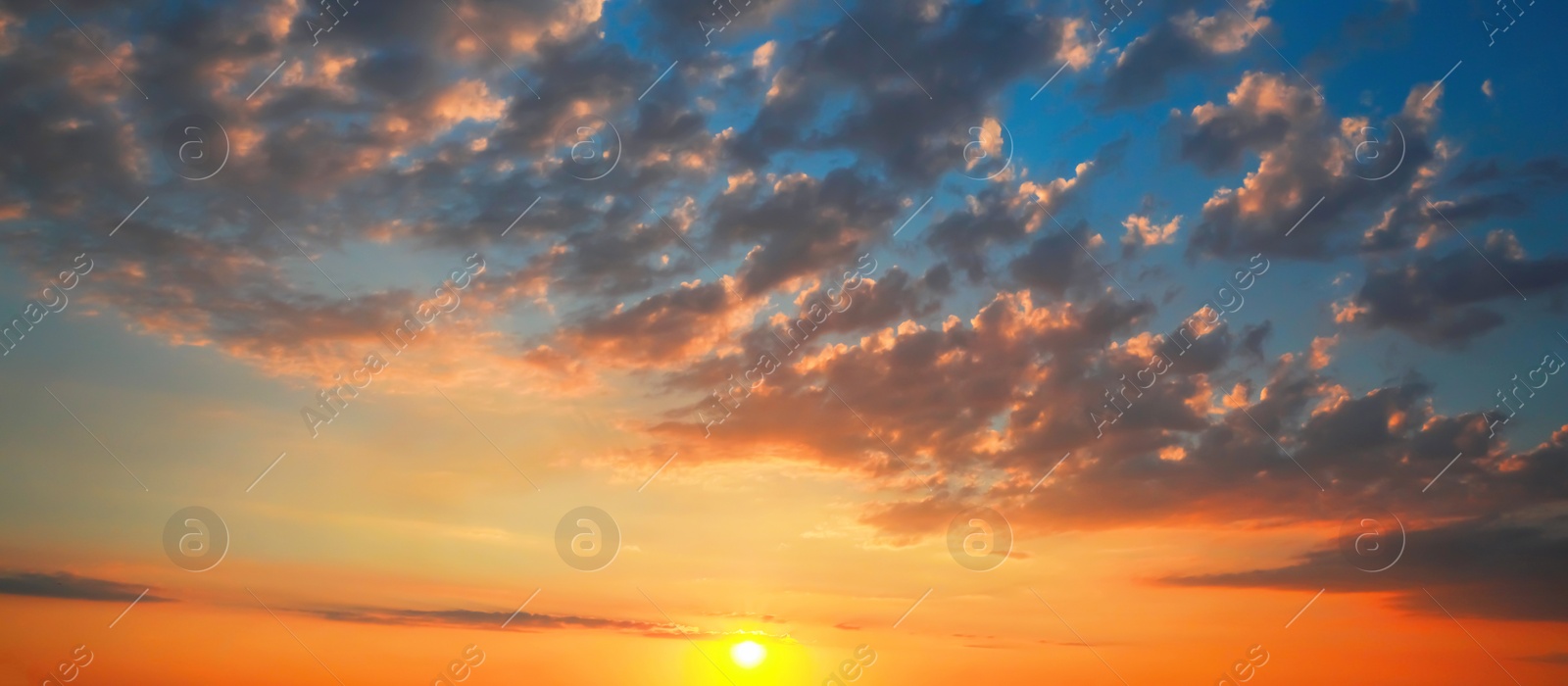 Image of Beautiful panorama of sky with clouds at sunset. Banner design