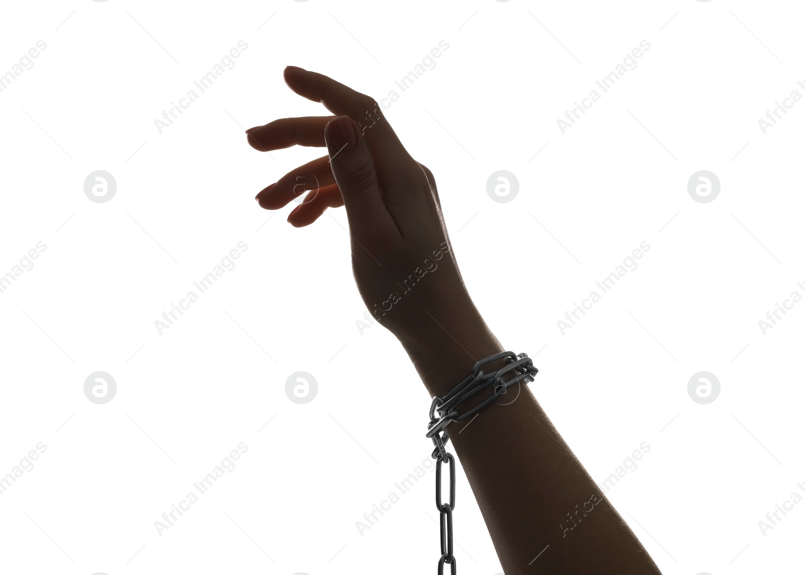 Photo of Freedom concept. Woman with chains on her hand against white background, closeup